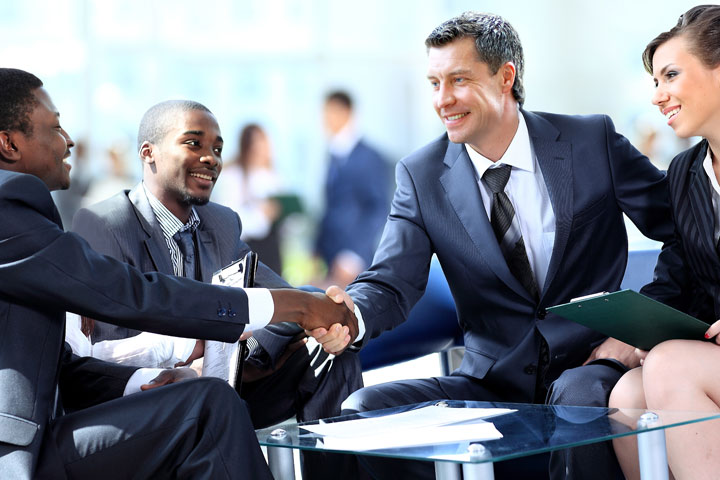 Business people shaking hands, finishing up a meeting