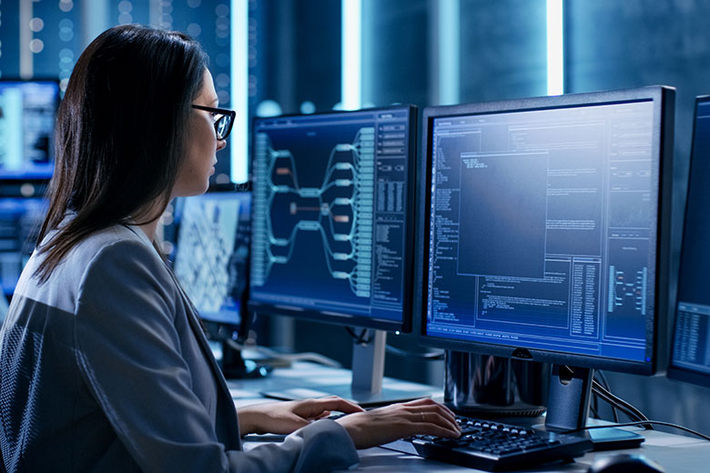 Woman sitting in front of a computer screen