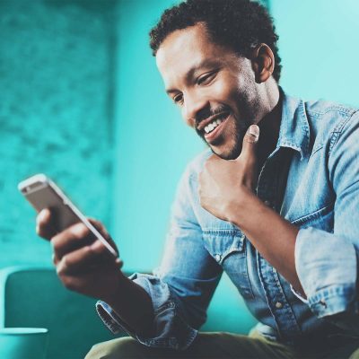 Man looking at the screen of smartphone