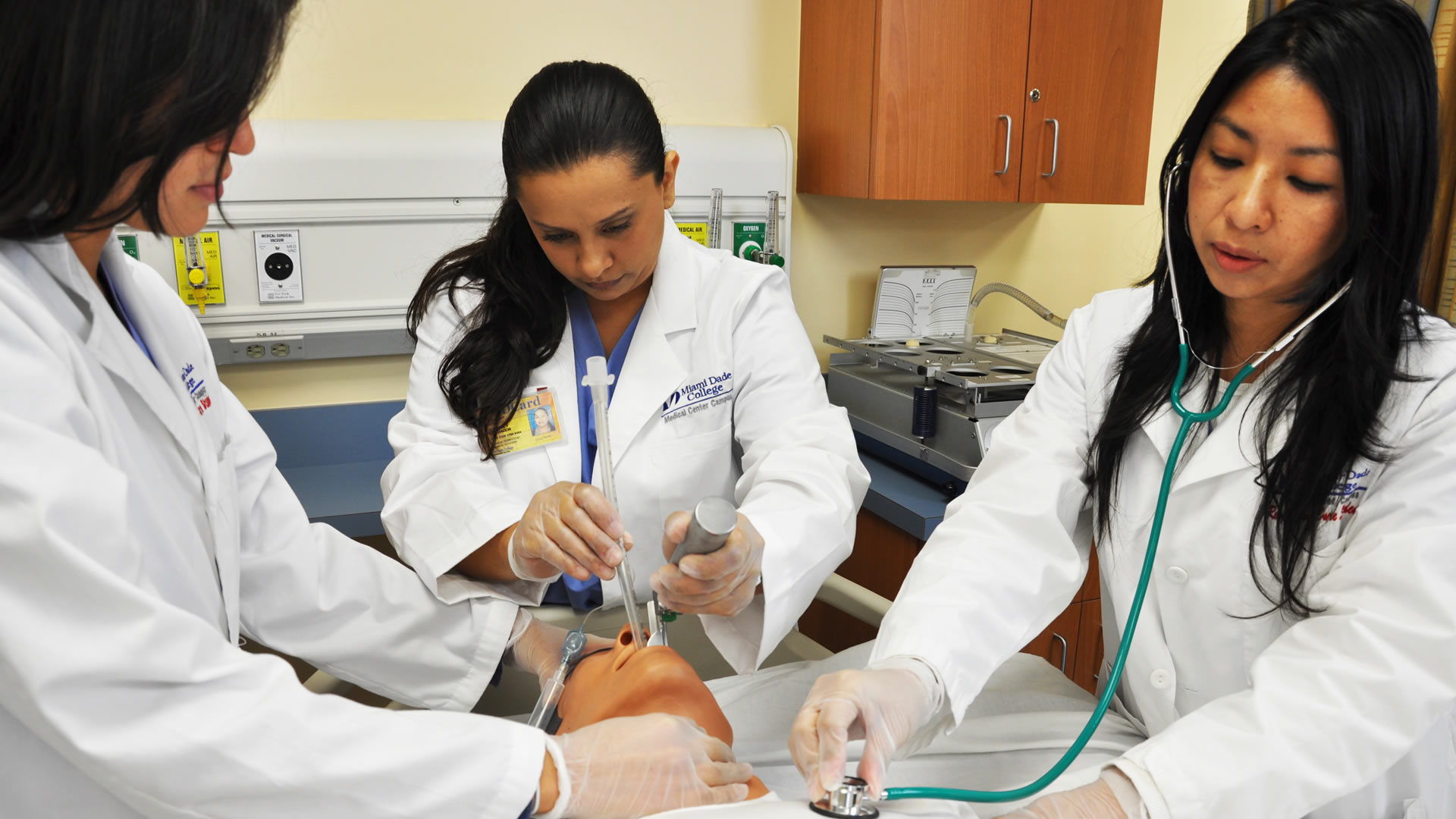 Students practice incubating a practice dummy