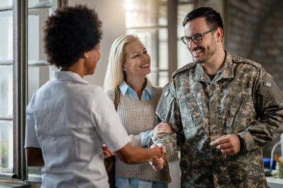 Military veteran meeting with someone for assistance.