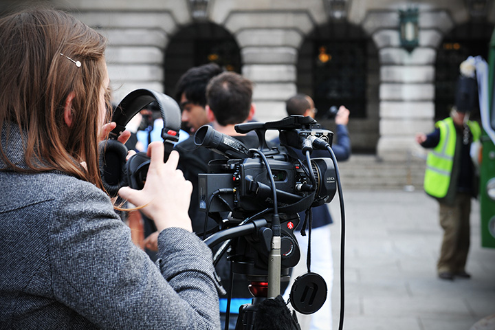 Student with a professional video camera