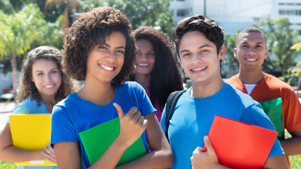 students standing together outside a classroom