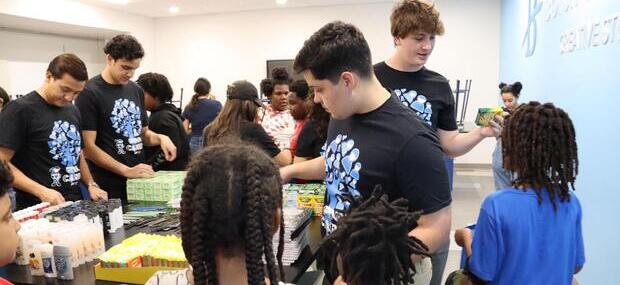 SGA officers sit at a table for a meeting