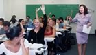 Female teacher assisting students in class