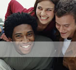 Three happy students smiling